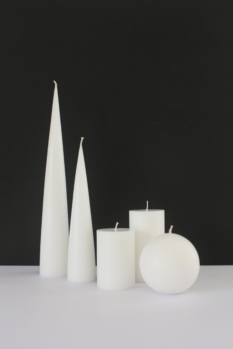image of white cone candles, ball candles and pillar candles on black background